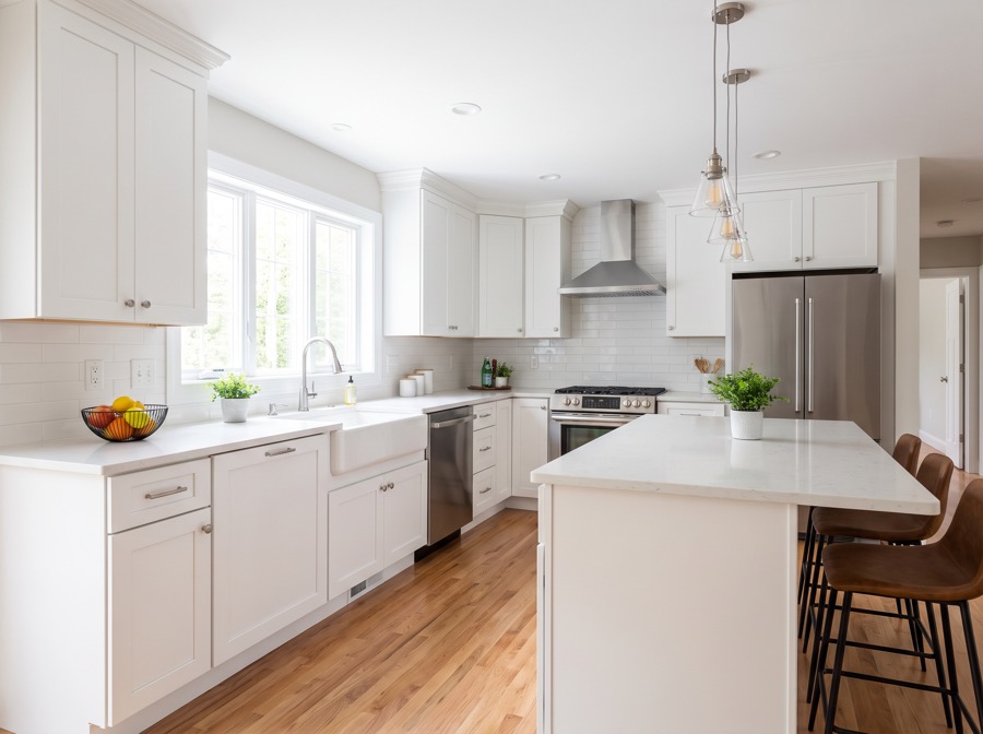 Freshly renovated kitchen with white cabinetry and an island